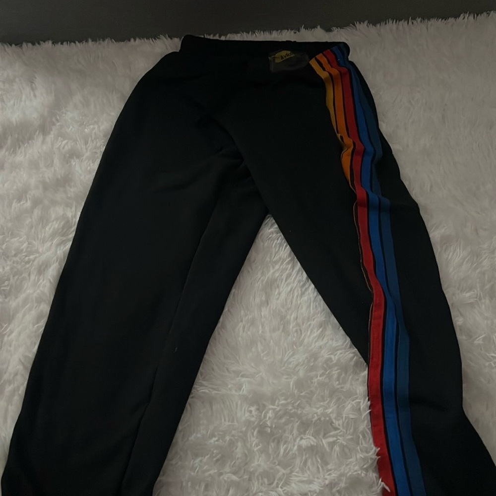Aviator nation sweatpants. Black with orange, yellow, red and blue stripes.